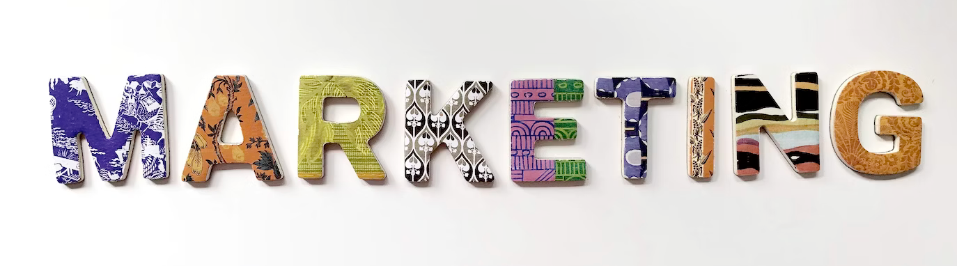 The word marketing is made up of different colored letters