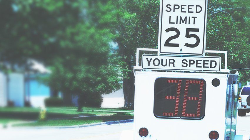 A speed limit sign that says 25 on it