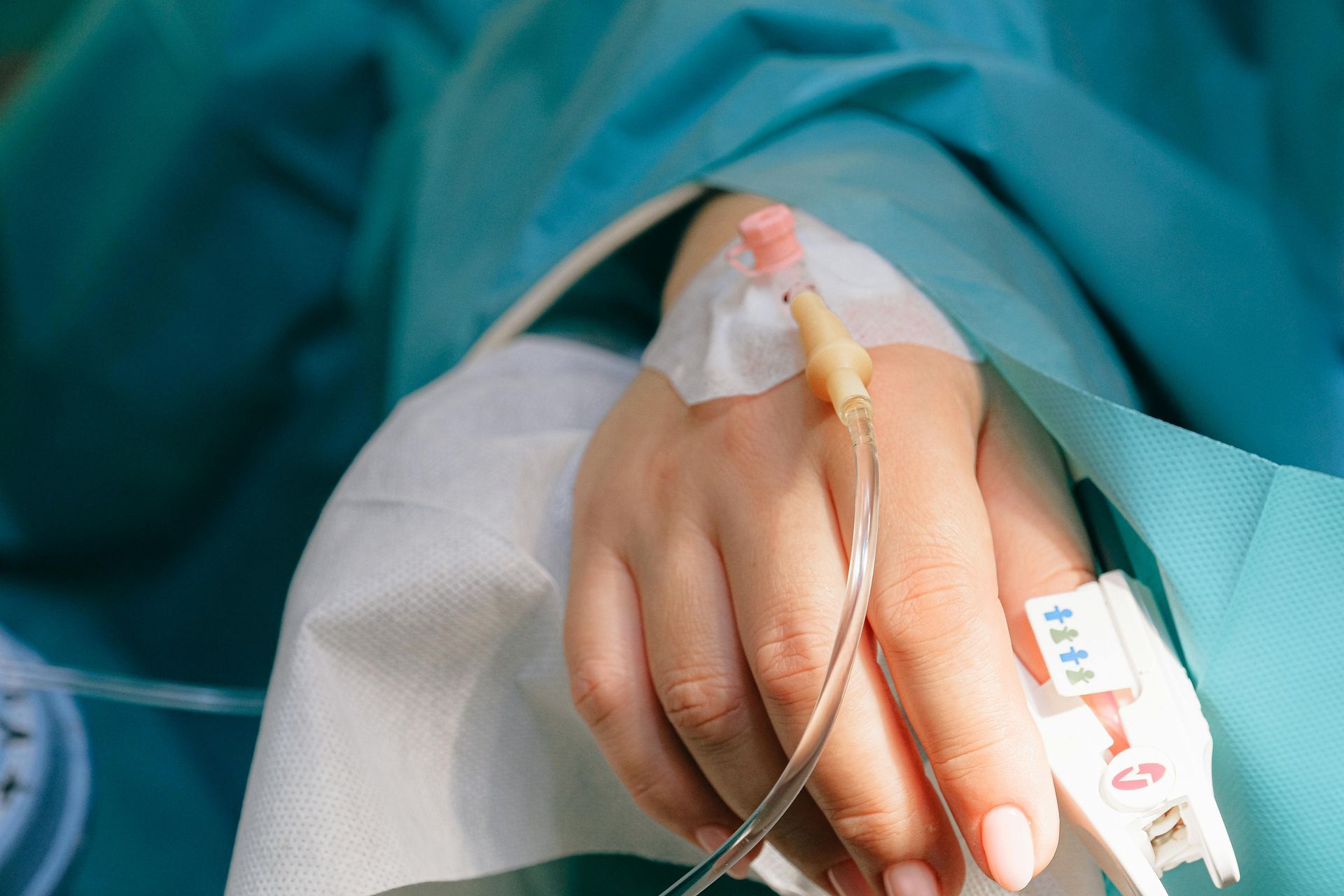 Two surgeons are operating on a patient in an operating room.