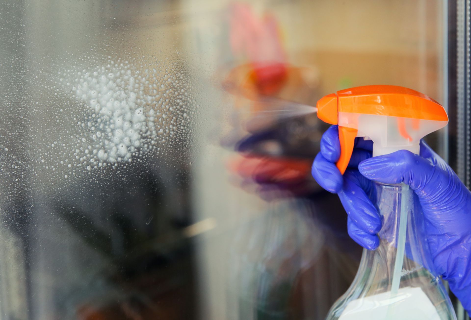 spraying window clean