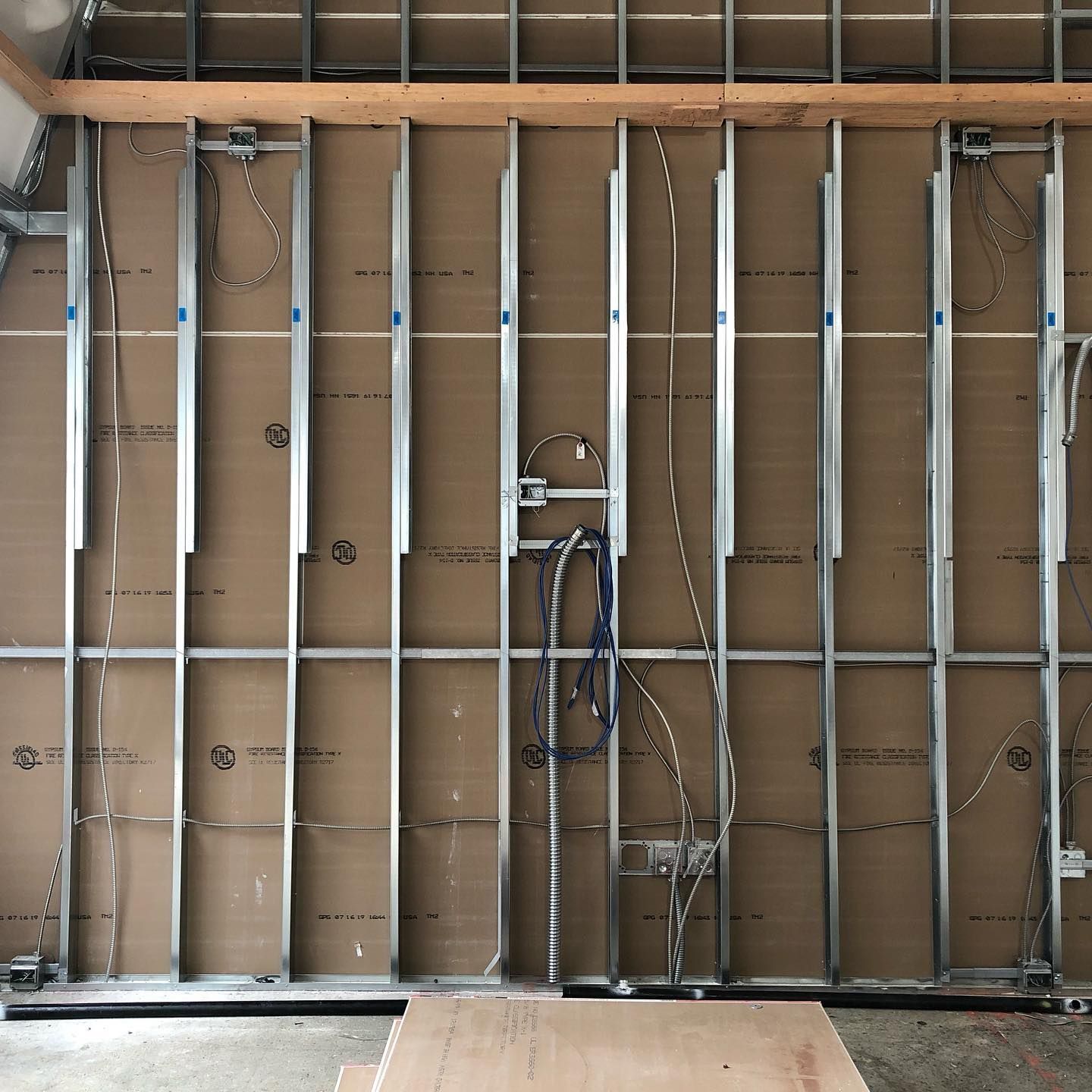 A wall that is being built with a ladder on it