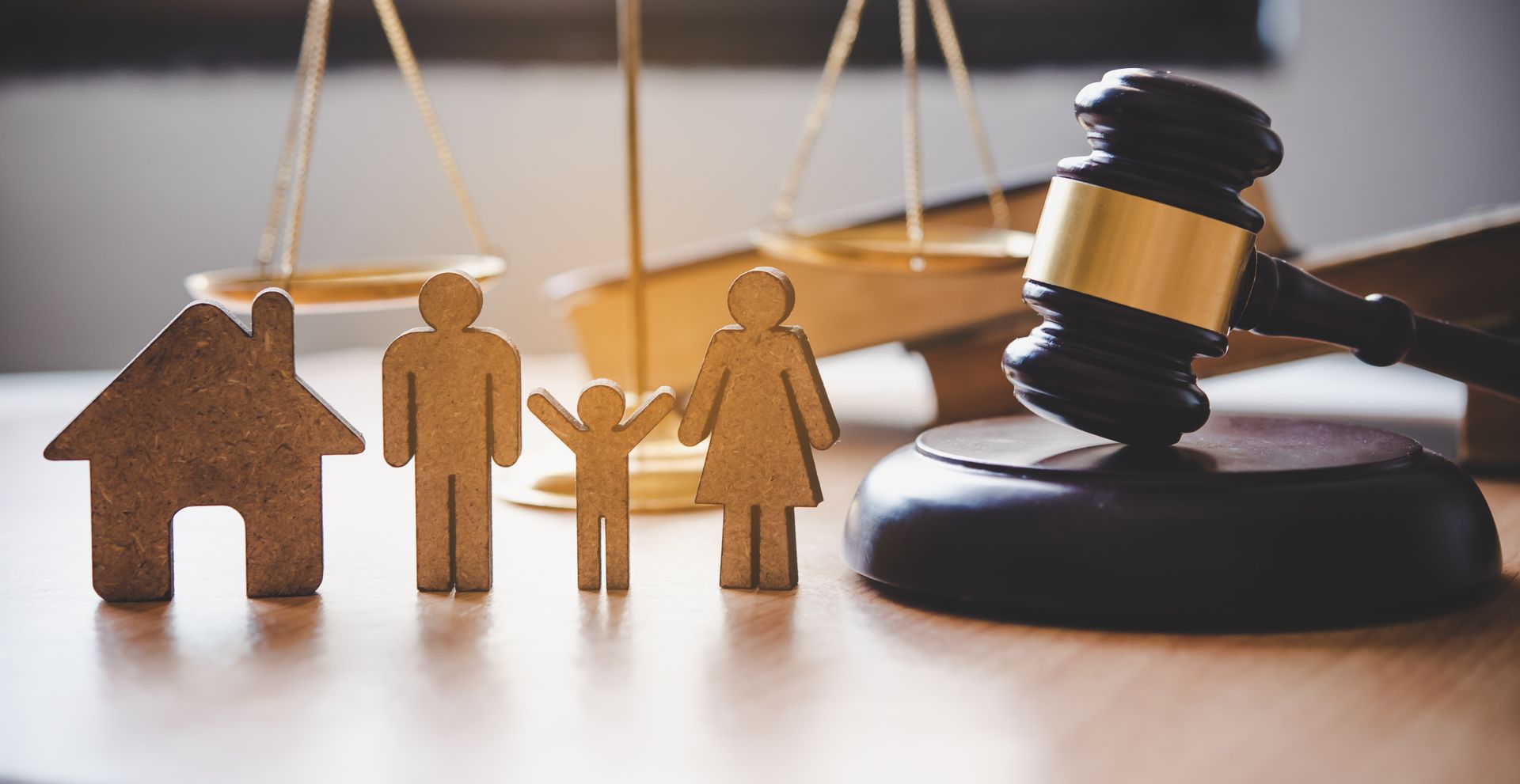 Family law concept showing scales of justice, parents, and a child.