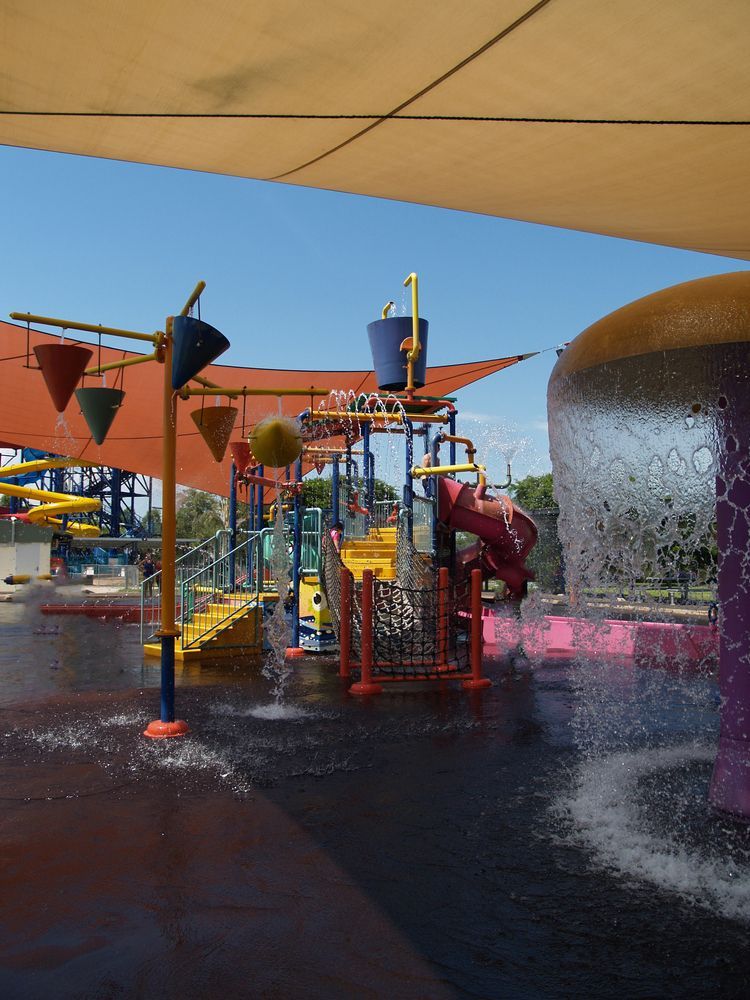 Water Park with Splash Features and Play Structures Under a Canopy on a Sunny Day — Nightcliff Plumbing & Gas In Leanyer, NT