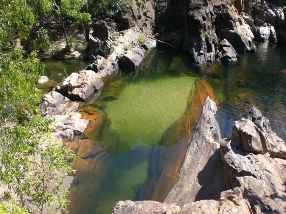 A Waterhole Surrounded By Rocks and Trees — Nightcliff Plumbing & Gas In Acacia Hills, NT