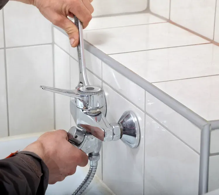 A Plumber Installing a New Tap In A Bathroom Renovation — Nightcliff Plumbing & Gas In Humpty Doo, NT