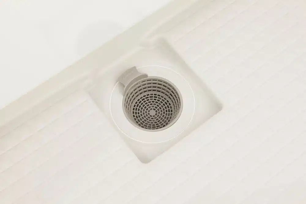 A Close Up of a Drain in a Bathroom — Nightcliff Plumbing & Gas In Coconut Grove, NT