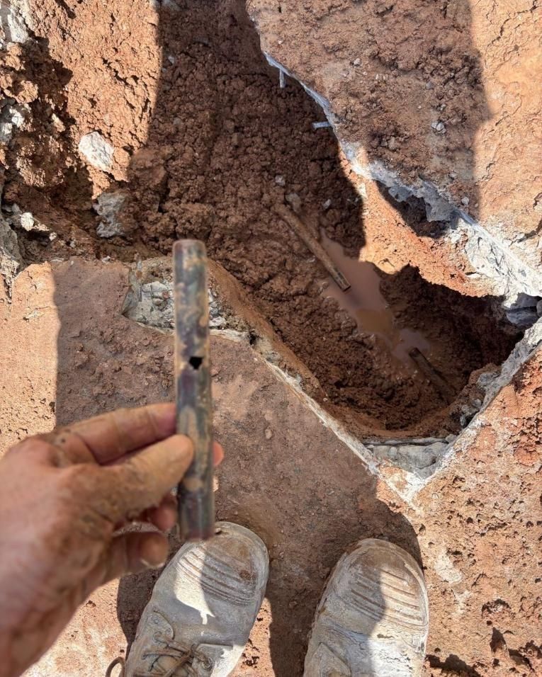 A Person is Holding a Piece of Metal in Their Hand — Nightcliff Plumbing & Gas In Coconut Grove, NT