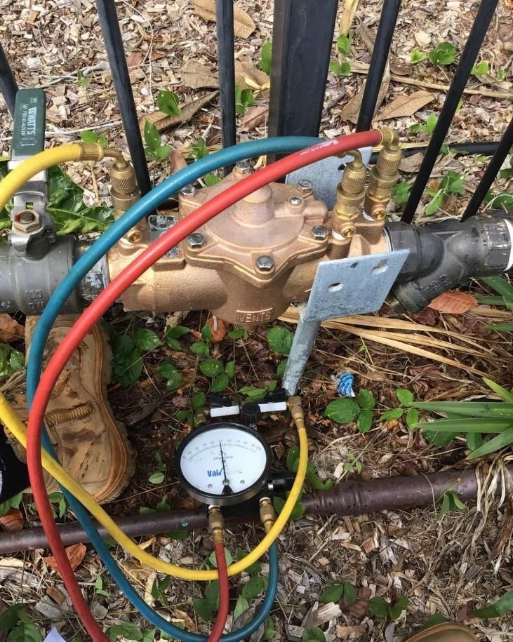 A Hose With a Gauge Attached to It is Connected to a Valve — Nightcliff Plumbing & Gas In Coconut Grove, NT
