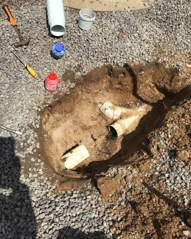 A Bunch of Pipes Are Laying in the Dirt on the Ground — Nightcliff Plumbing & Gas In Coconut Grove, NT