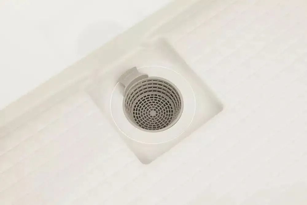 A Close Up of a Drain in a Bathroom — Nightcliff Plumbing & Gas In Coconut Grove, NT