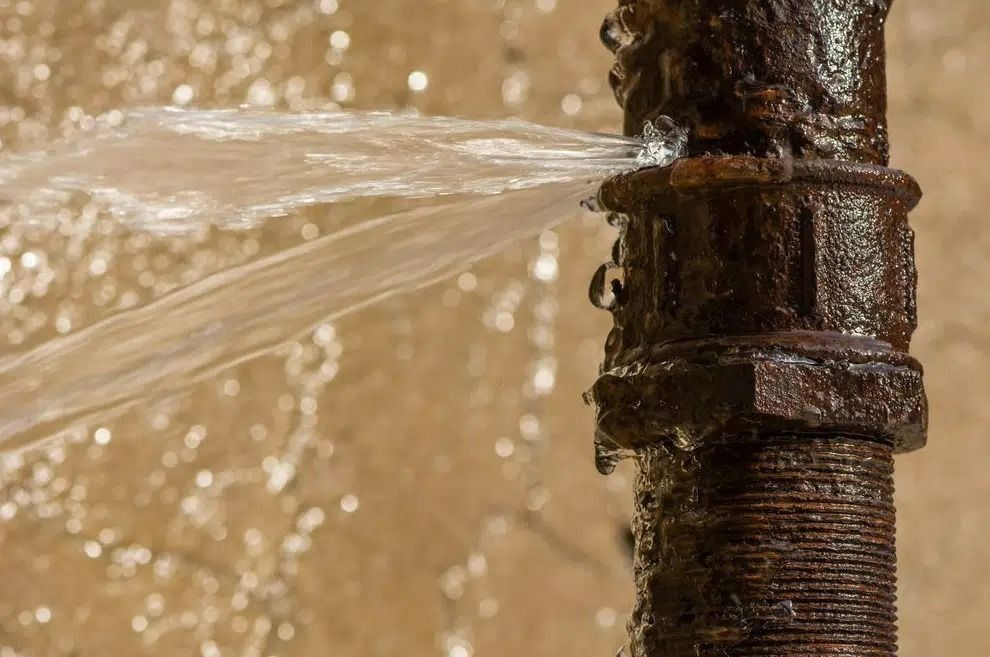 A Rusty Pipe is Leaking Water and Water is Coming Out of It — Nightcliff Plumbing & Gas In Coconut Grove, NT
