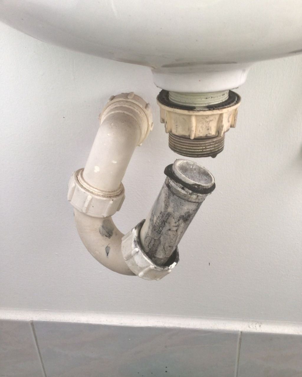 A White Sink With a Drain Pipe Coming Out of It — Nightcliff Plumbing & Gas In Coconut Grove, NT