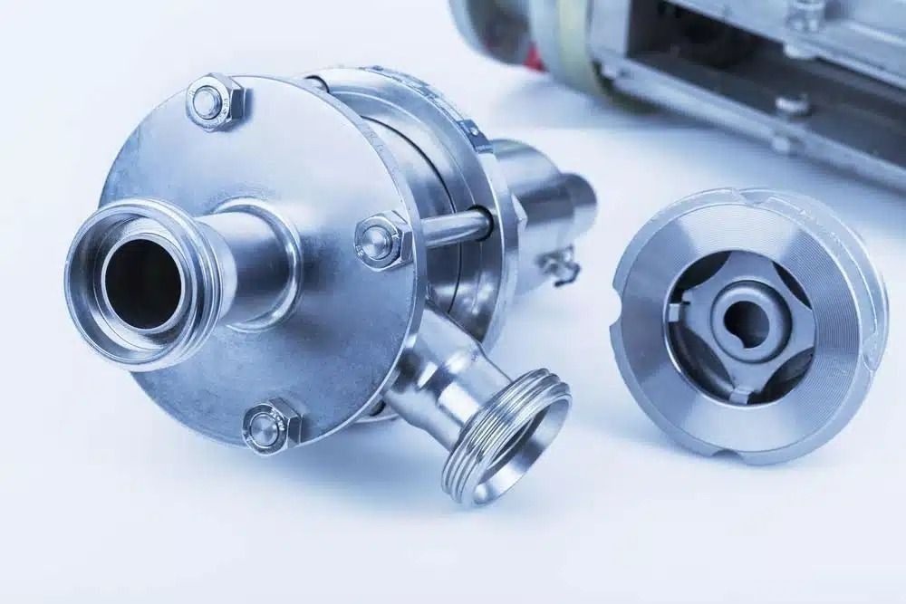 A Close Up of a Stainless Steel Pump on a White Surface — Nightcliff Plumbing & Gas In Coconut Grove, NT