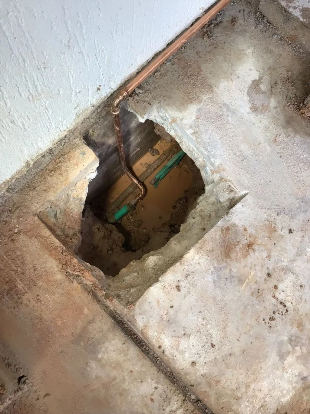 A Hole in the Floor With a Pipe Coming Out of It — Nightcliff Plumbing & Gas In Coconut Grove, NT