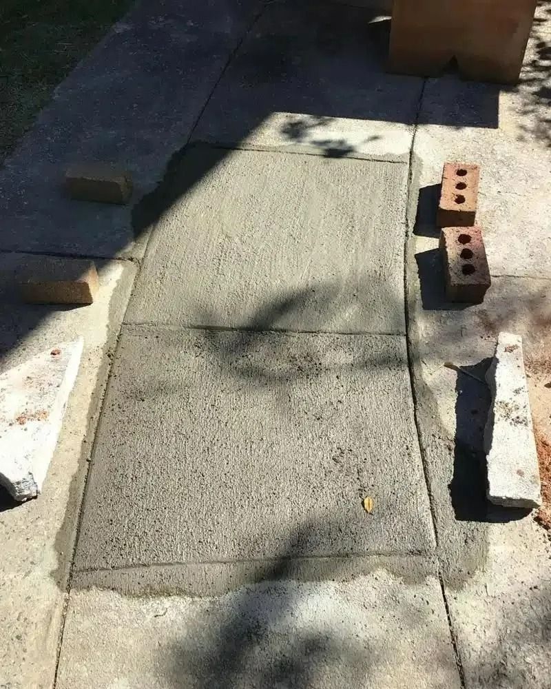 A Brick Wall is Being Built on a Sidewalk — Nightcliff Plumbing & Gas In Coconut Grove, NT