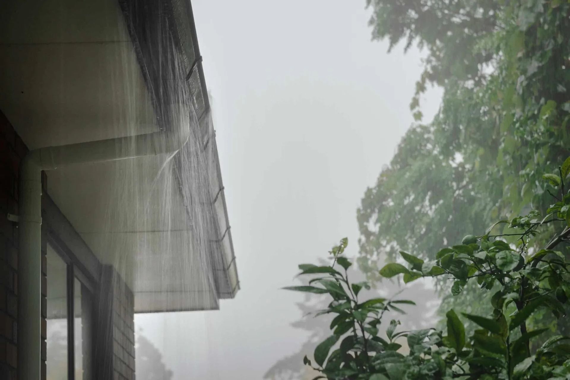 Rain is Falling From the Roof of a Building — Nightcliff Plumbing & Gas In Coconut Grove, NT
