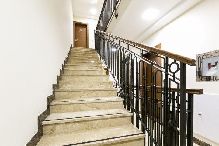 Hotel stairway and handrail leading to top door