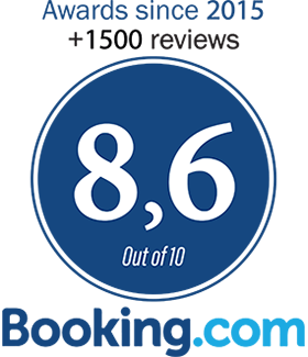 Booking.com rating badge, blue circle with 8.6 out of 10 and text “Awards since 2015” and “+1500 reviews”