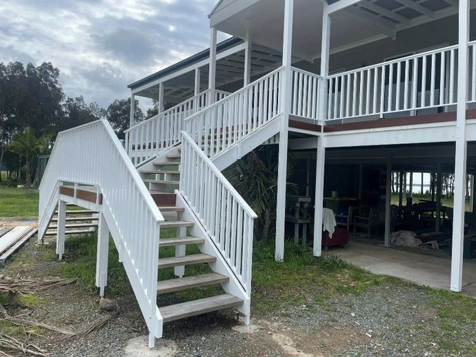A White House with Stairs Leading up To the Second Floor — Topline Aluminium Forster Pty Ltd in Forster, NSW