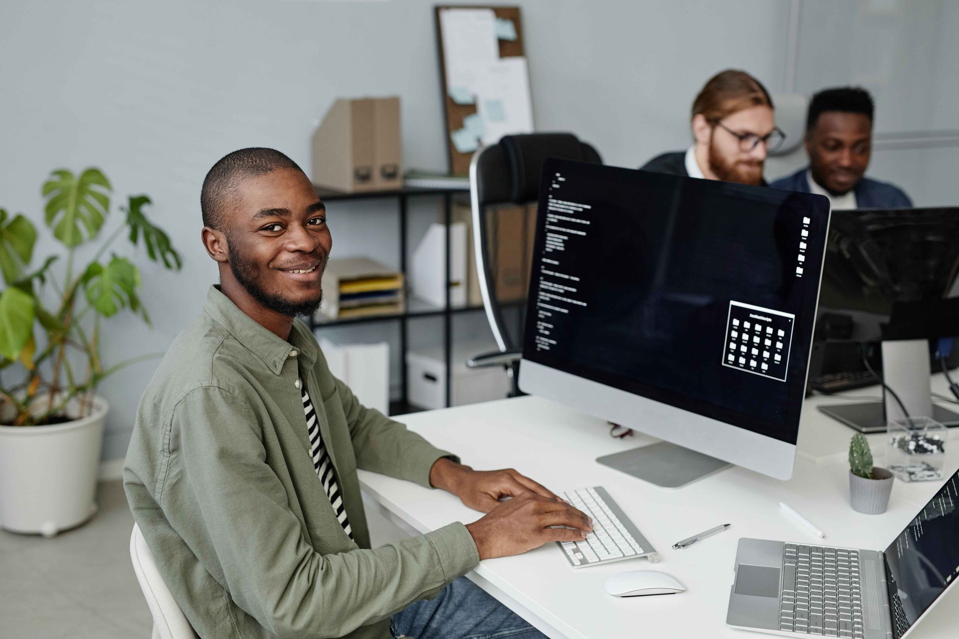 Happy young African American diversity programmer in casual clothes