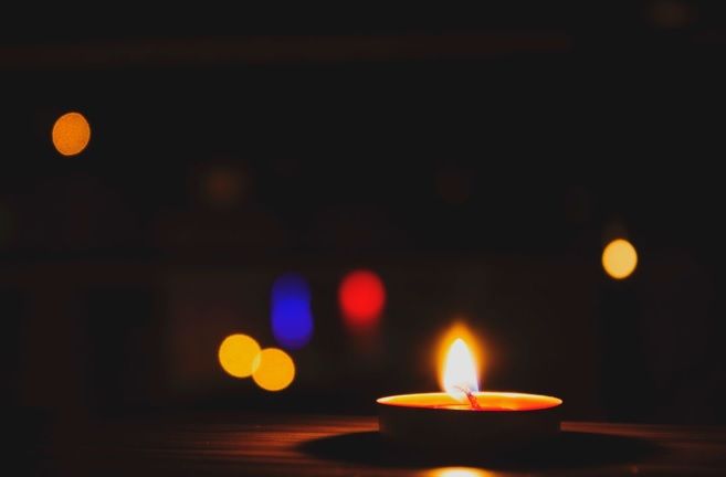 Candle with soft bokeh background for cremation services Walla Walla, WA.