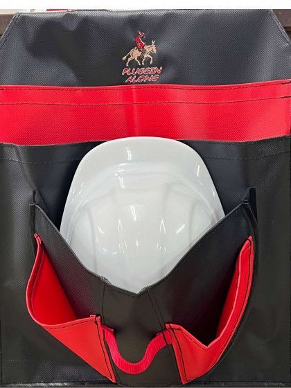 Black and red tool bag with a white hard hat in the front pocket