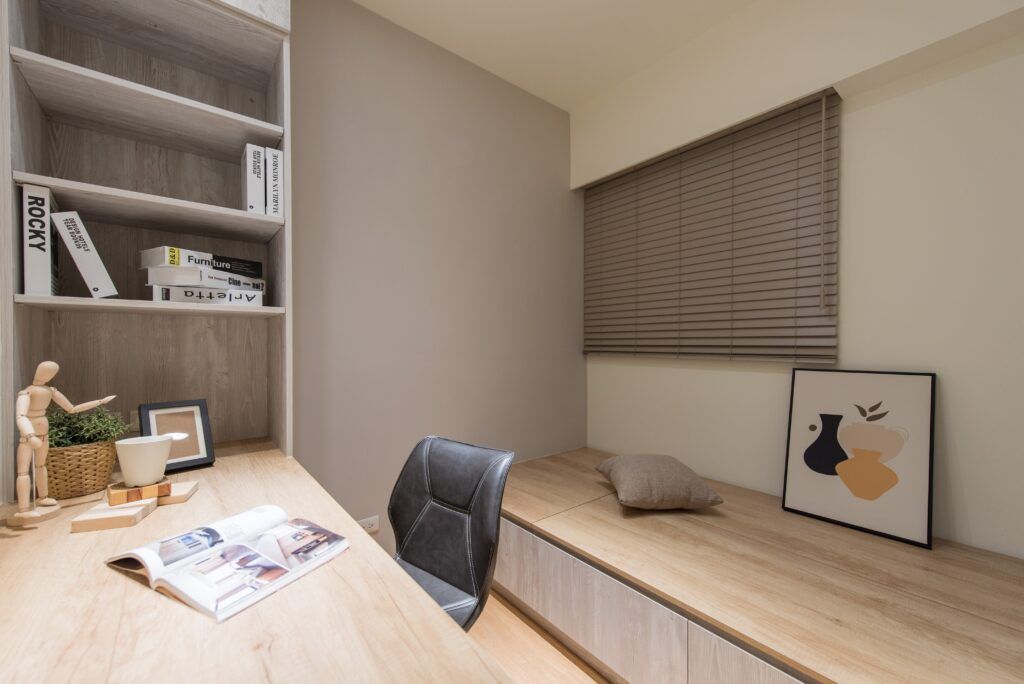 A Desk With a Chair and a Book on It in a Room — TT Shutters & Shading In Ballina, NSW