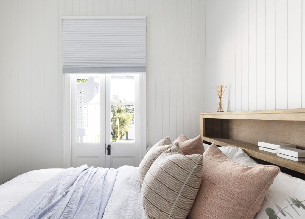 A Bedroom With a Bed — TT Shutters & Shading In Ballina, NSW