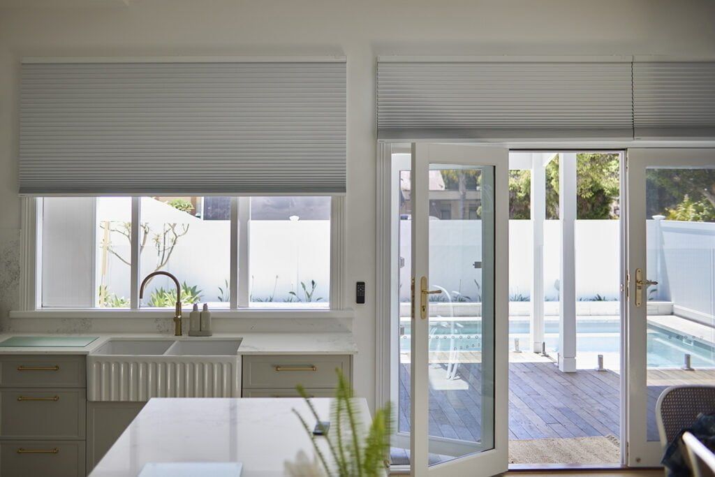 HOneycomb blinds in a white kitchen  — TT Shutters & Shading In Ballina, NSW