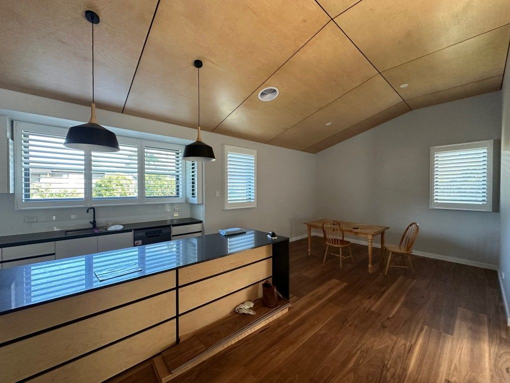 A Kitchen With a Table and Chairs in It — TT Shutters & Shading In Ballina, NSW