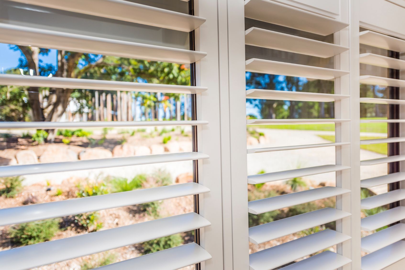 A Close Up Of A Window With Shutters On It — TT Shutters & Shading In Ballina, NSW