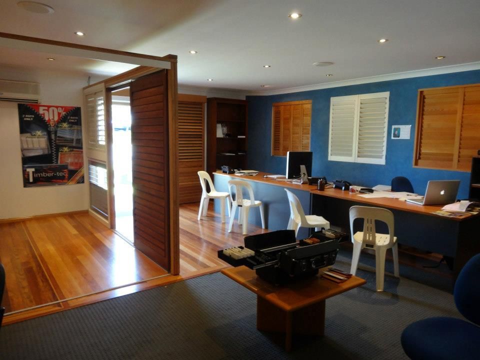 A Room With a Table and Chairs and a Sign That Says 50 — TT Shutters & Shading In Lismore, NSW