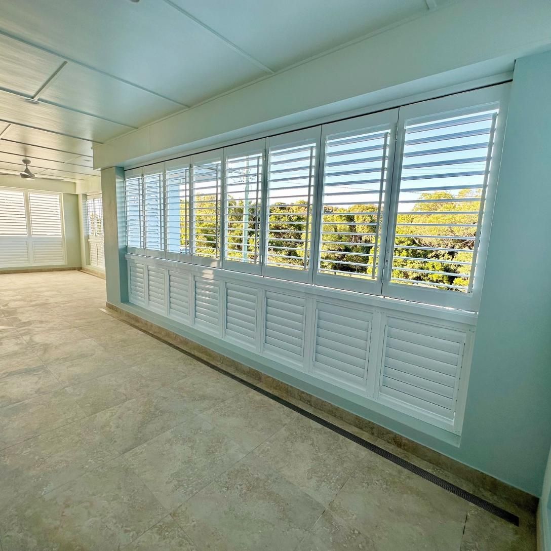 A Room With a Lot of Windows and Shutters on Them — TT Shutters & Shading In Lennox Head, NSW