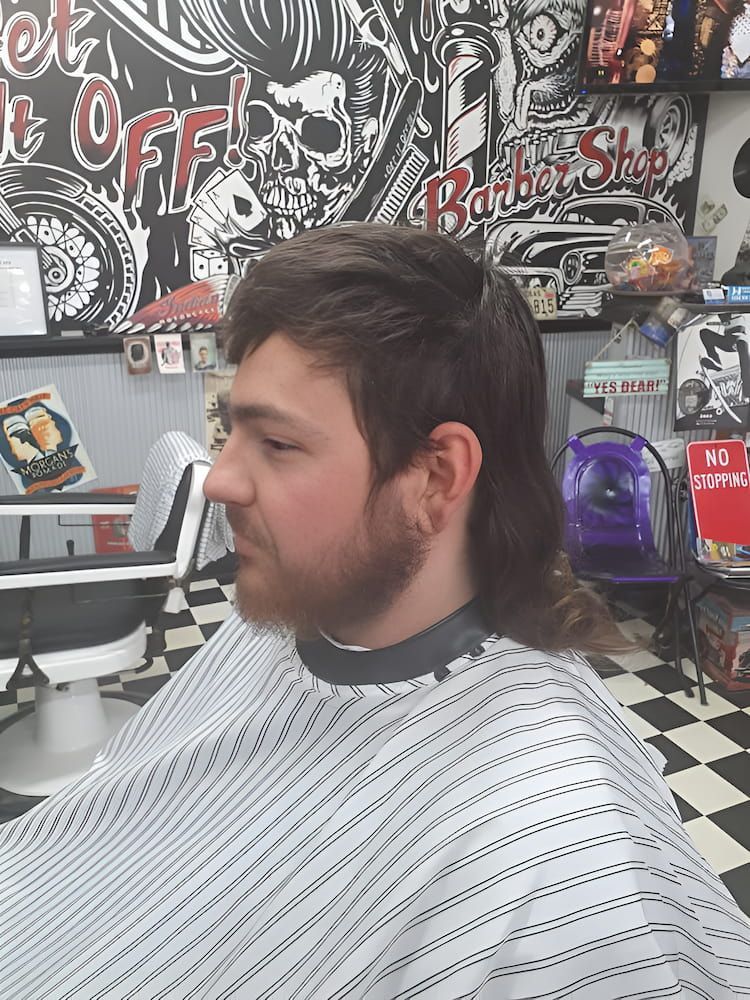 A Man Is Getting His Hair Cut At A Barber Shop — The Barber Social In Raymond Terrace, NSW