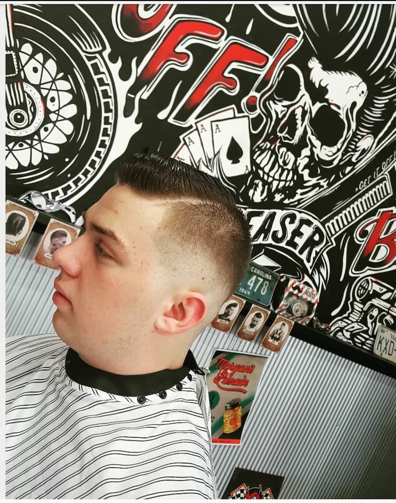 A Man Is Getting His Hair Cut At A Barber Shop — The Barber Social In Raymond Terrace, NSW
