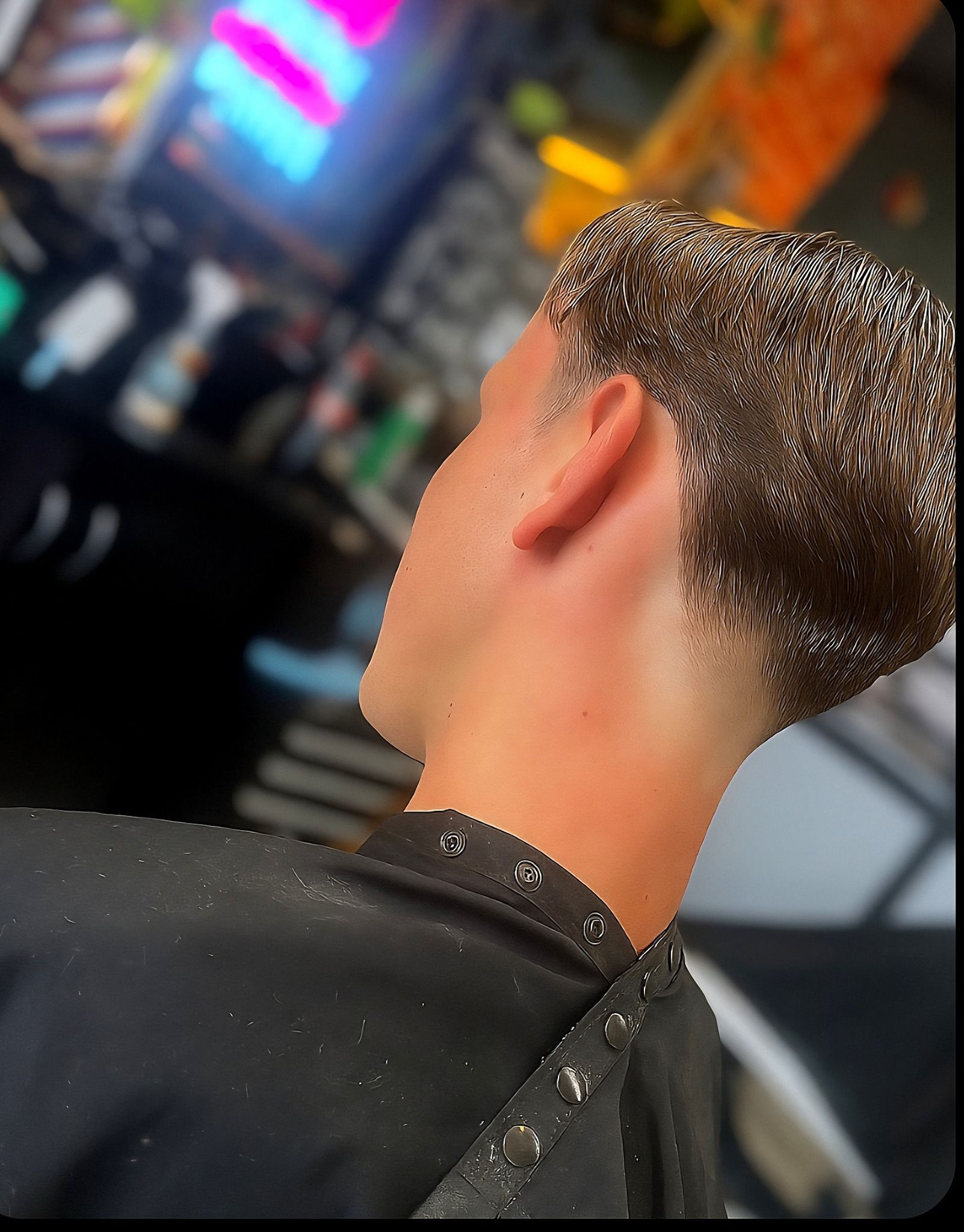 A Close Up of A Person with A Faded Haircut Wearing a Barbers Cape in A Salon — The Barber Social In Raymond Terrace, NSW