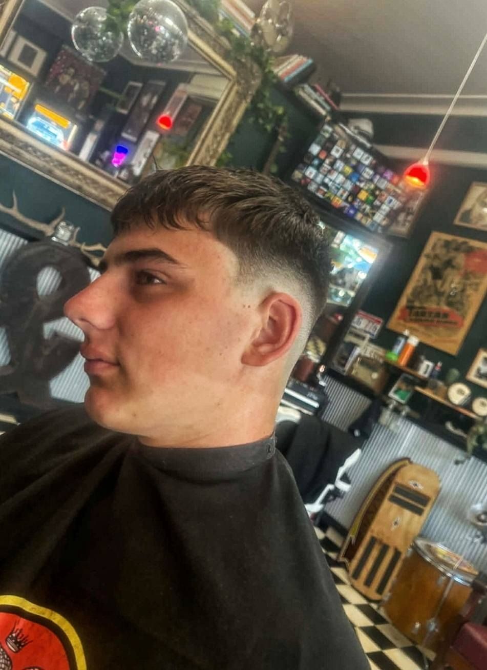 A Person with A Fresh Short Back And Sides Haircut Seated in A Barbershop — The Barber Social In Raymond Terrace, NSW