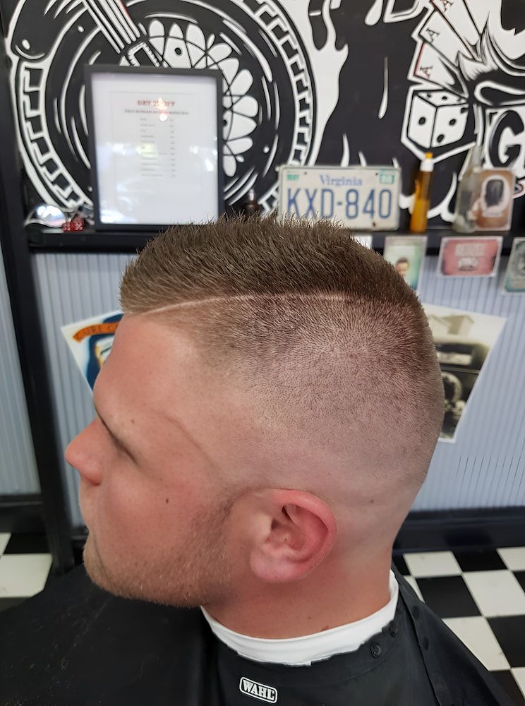A Man Is Getting His Hair Cut At A Barber Shop — The Barber Social In Raymond Terrace, NSW