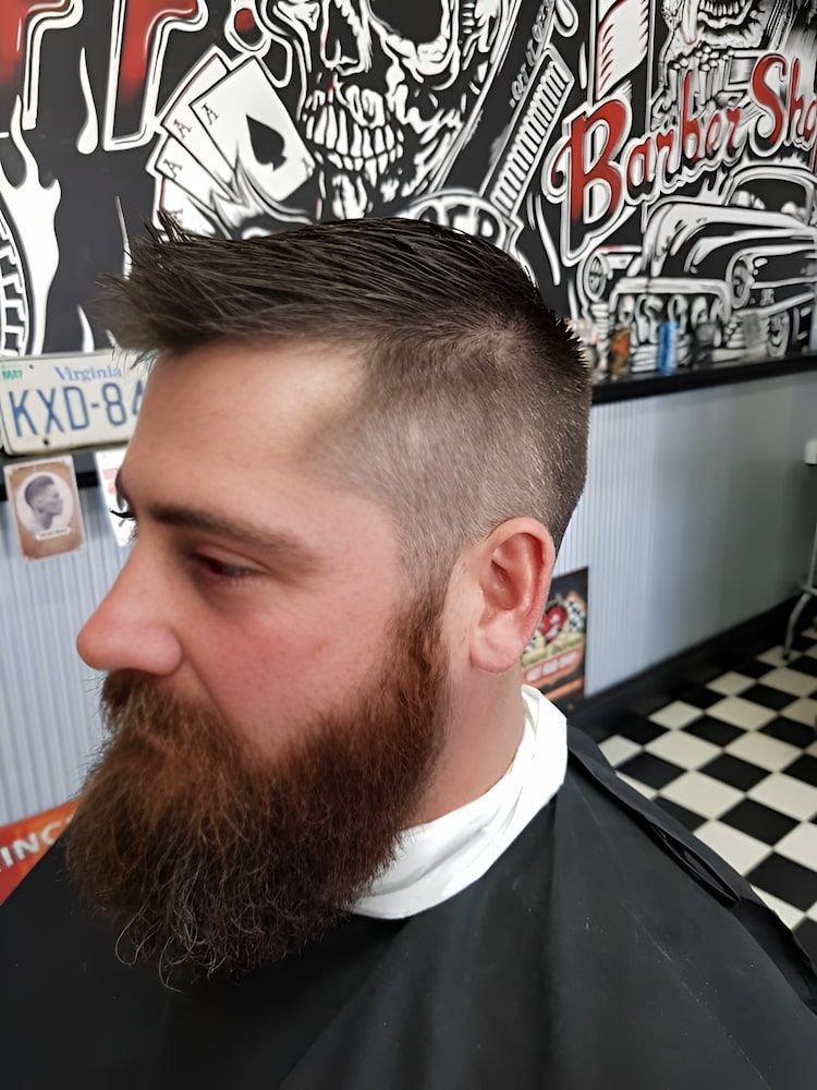 A Man With A Beard Is Getting His Hair Cut At A Barber Shop — The Barber Social In Raymond Terrace, NSW