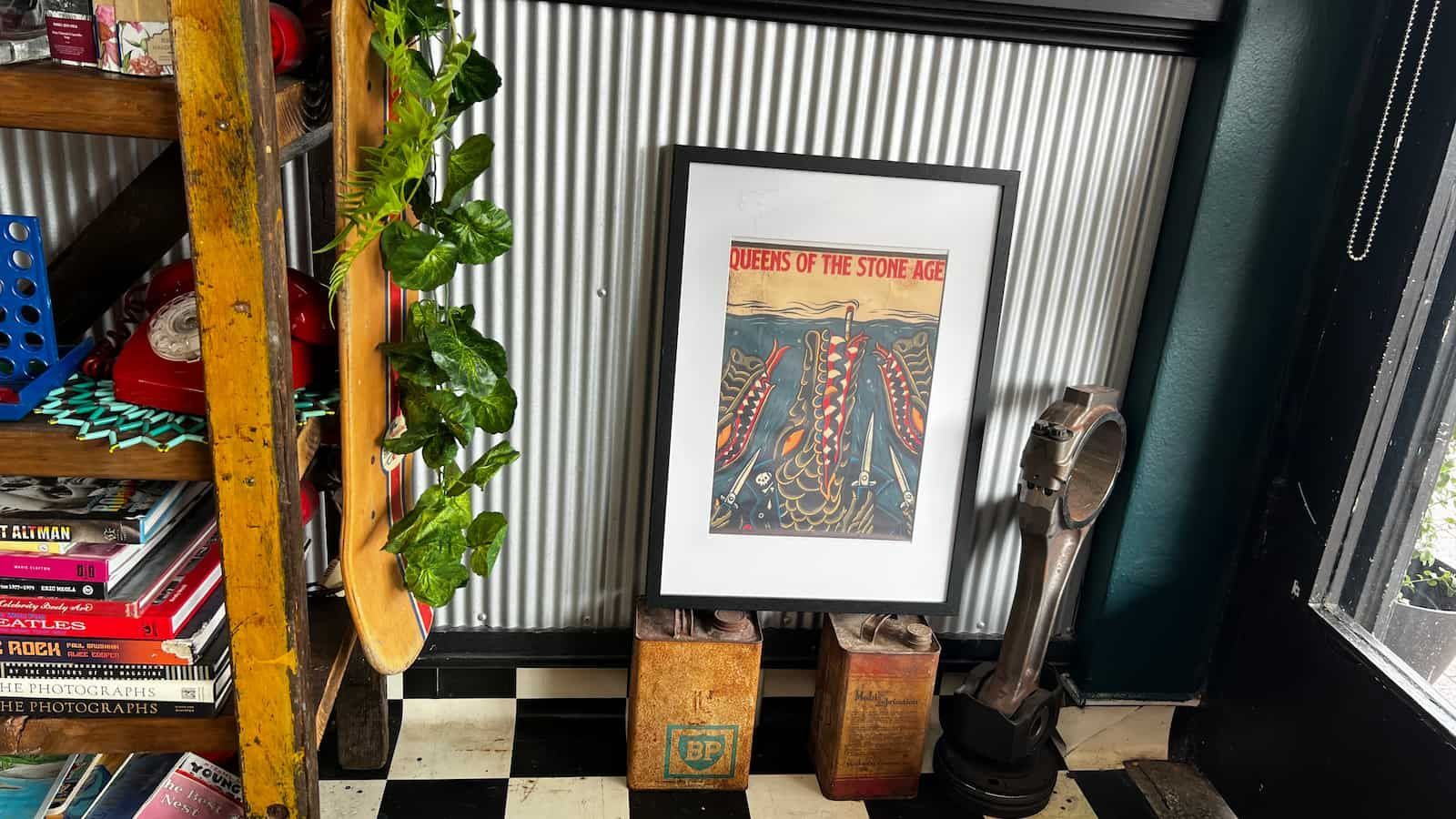 A Room With A Picture On The Wall And A Checkered Floor — The Barber Social In Raymond Terrace, NSW
