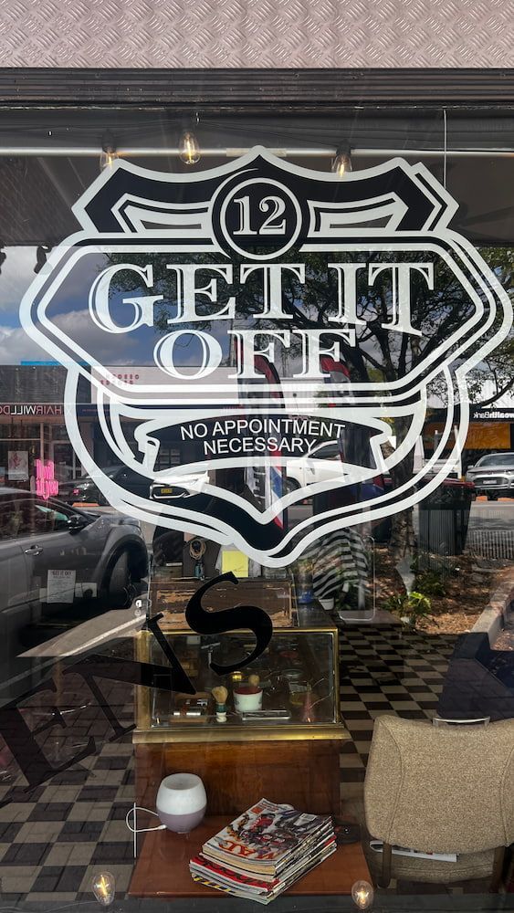 A Store Window With A Logo On It That Says  Get It Off — The Barber Social In Raymond Terrace, NSW