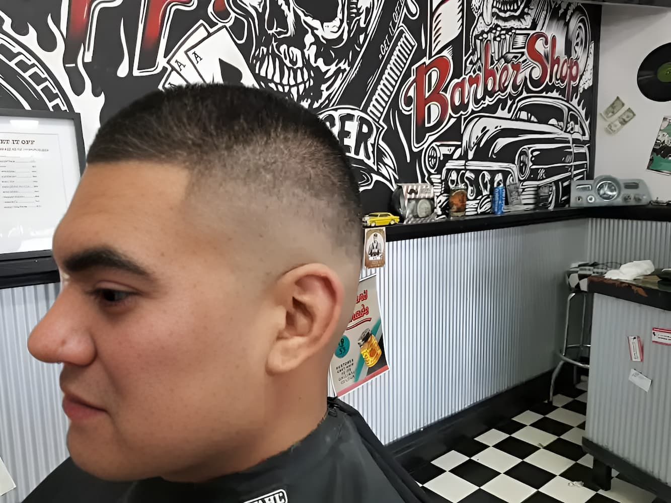 A Man Is Getting His Hair Cut At A Barber Shop — The Barber Social In Raymond Terrace, NSW