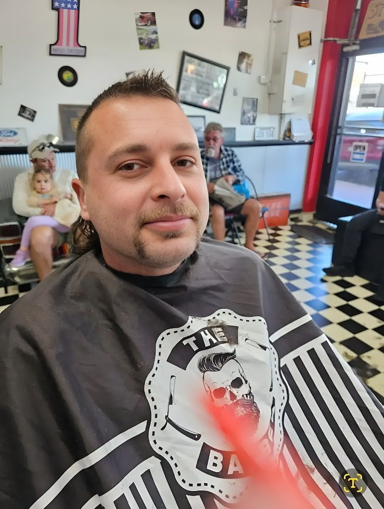 A Man Is Getting His Hair Cut At A Barber Shop — The Barber Social In Raymond Terrace, NSW
