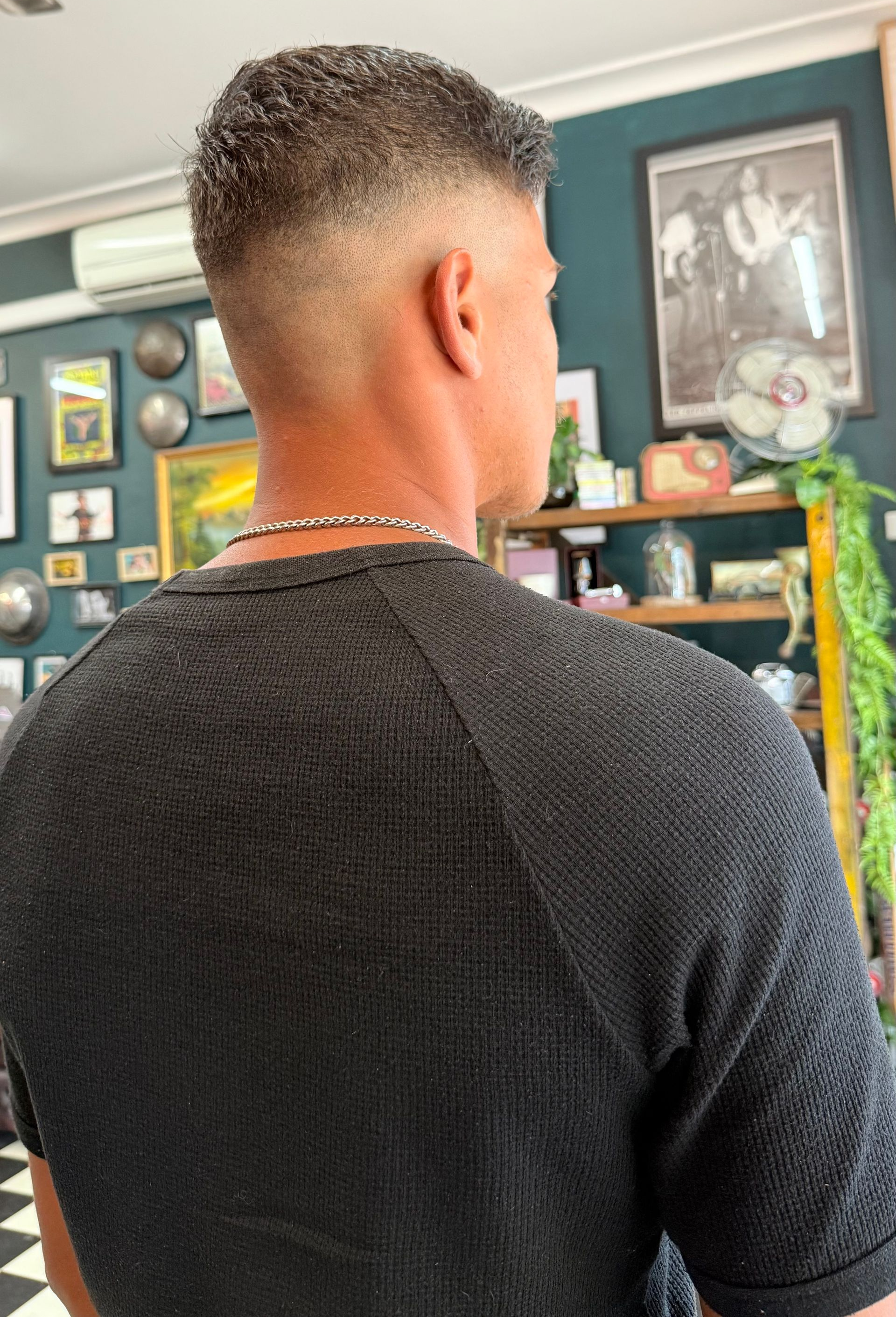 A Person from Behind Showing a Faded Haircut in A Shop — The Barber Social In Raymond Terrace, NSW