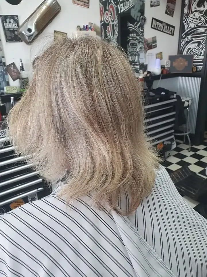 A Woman Is Getting Her Hair Cut At A Barber Shop — The Barber Social In Raymond Terrace, NSW