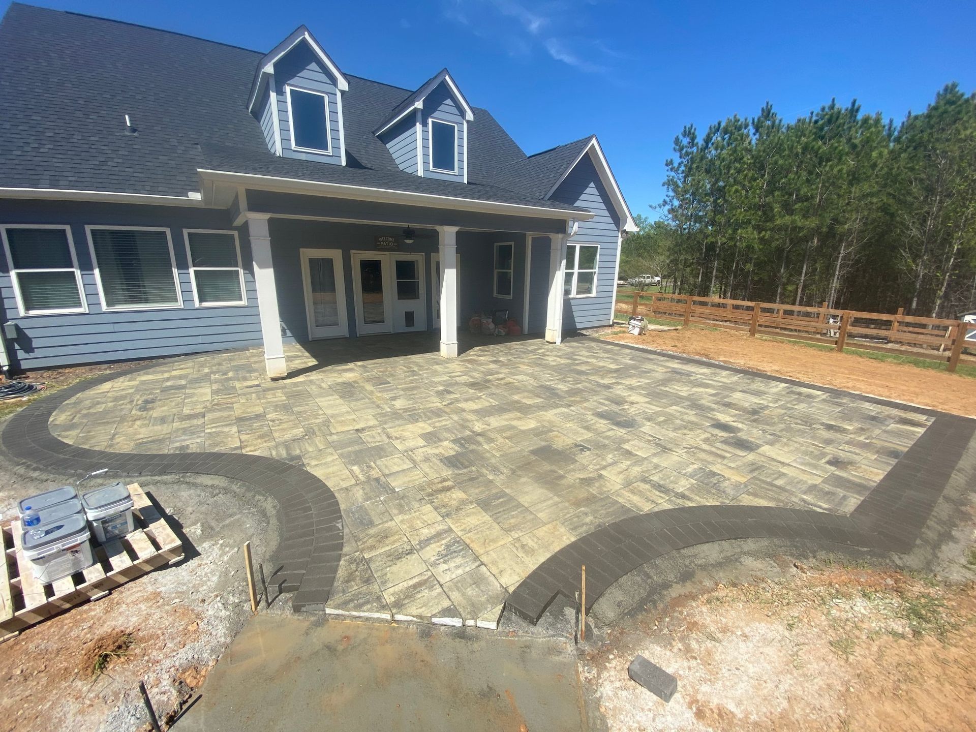 A large house with a patio in front of it