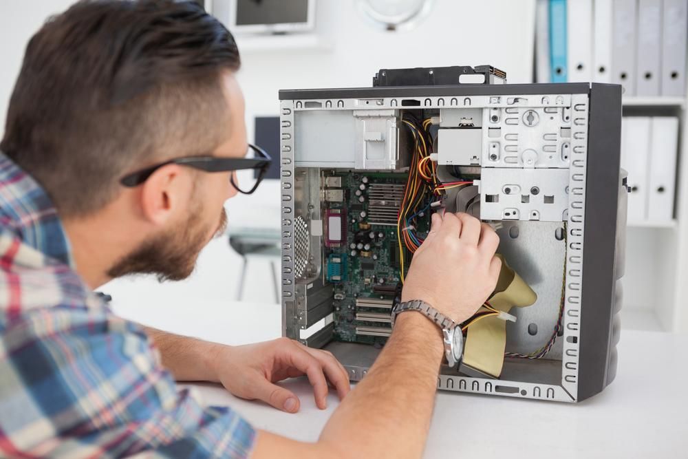 A Man is Working on the Inside of a Computer — Leading Edge Computers in Forster, NSW