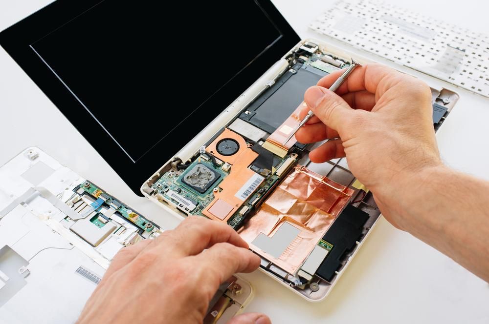 A Person is Repairing a Laptop — Leading Edge Computers in Forster, NSW