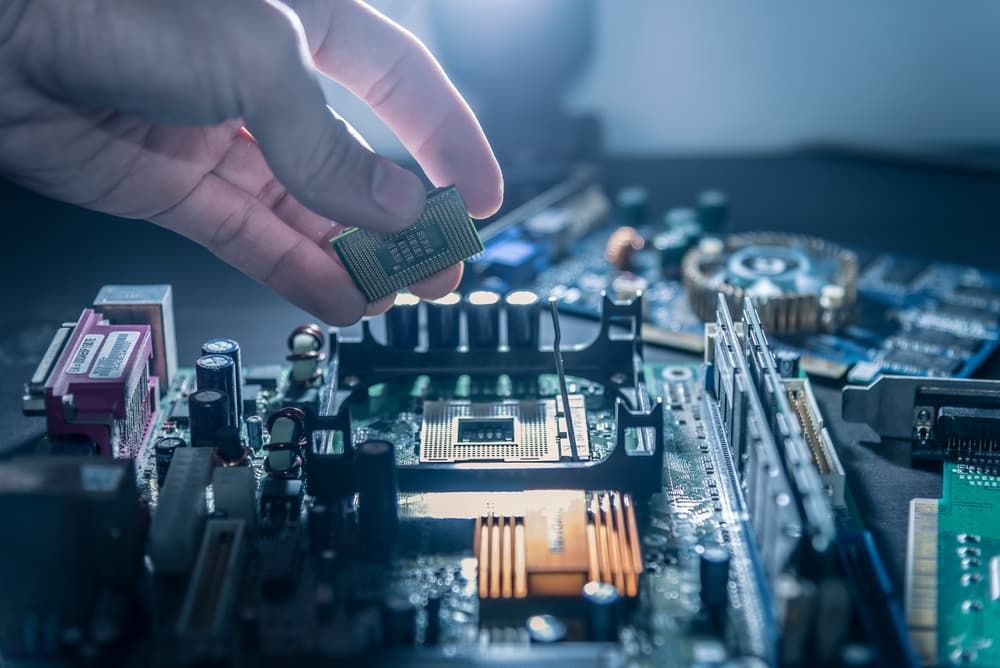 A Person is Installing a Processor on a Motherboard — Leading Edge Computers in Forster, NSW