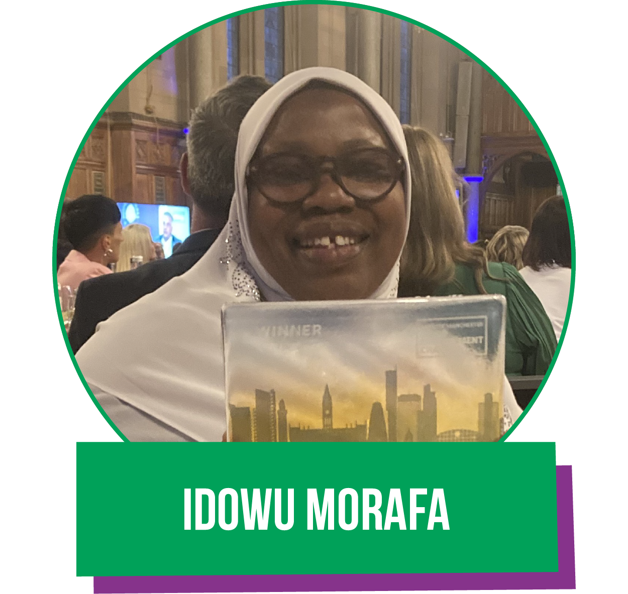 A woman in a white hijab is holding a book titled idowu morafa